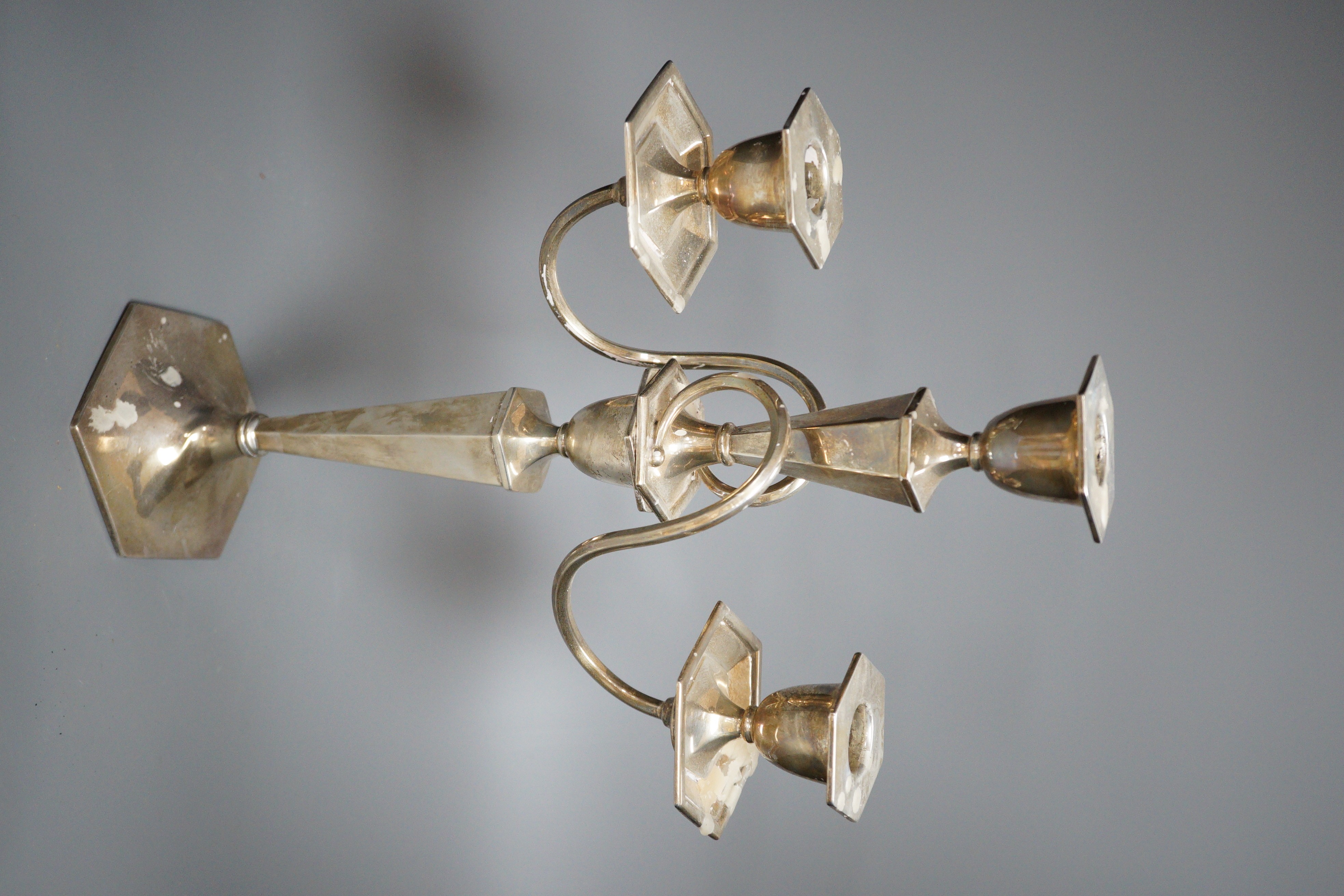 A George V silver two branch, three light candelabrum, marks rubbed, height 39cm, weighted.
